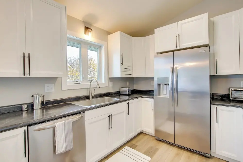Bright Little Chute Condo w/ Deck & Yard!