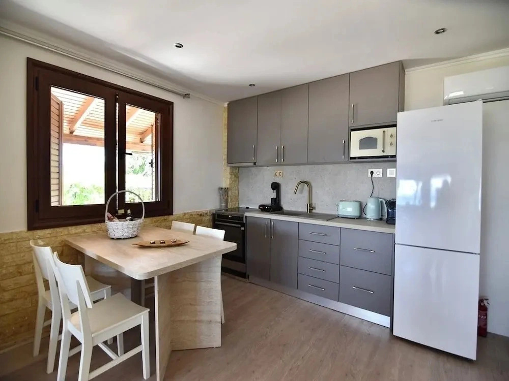 Spacious Beachfront Retreat With Large Garden in Ormos Panagias