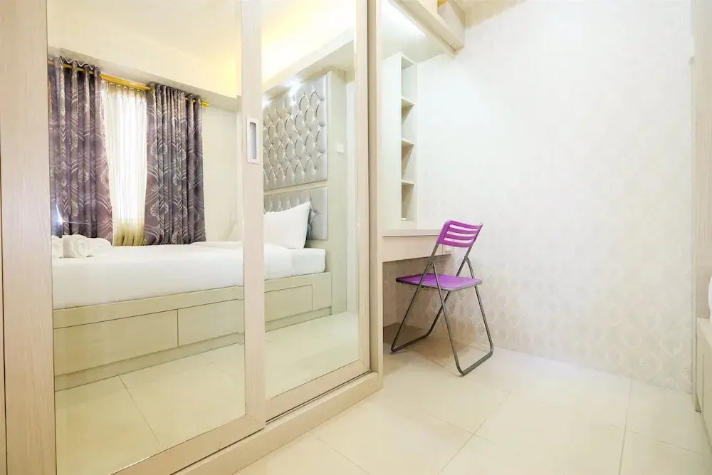 Pool View 2BR Bassura City Apartment By Travelio