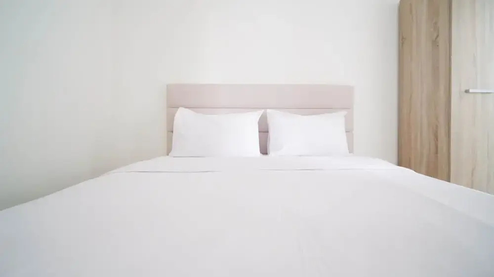 Compact and Tidy Studio at Puncak Dharmahusada Apartment By Travelio