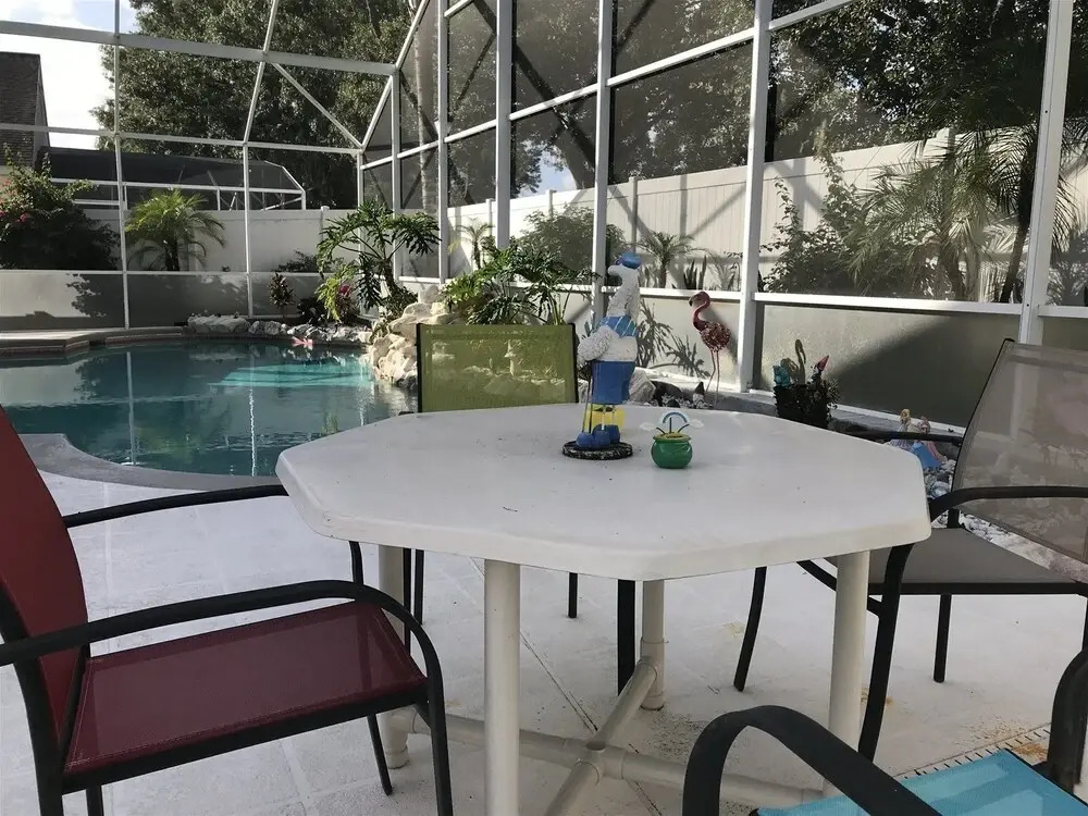 3 Bedroom Home With Private Screened Pool With Rock Waterfall Feature and Gameroom by Florida Dream Homes