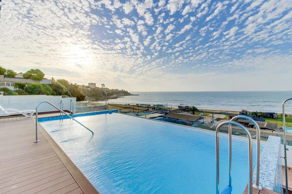 Contemporary apartment w/ a full kitchen, ocean views, & rooftop deck