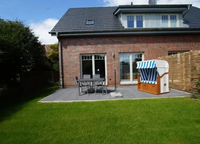 Inselparadies - Neubauwohnung mit großer Terrasse, Strandkorb und Garten
