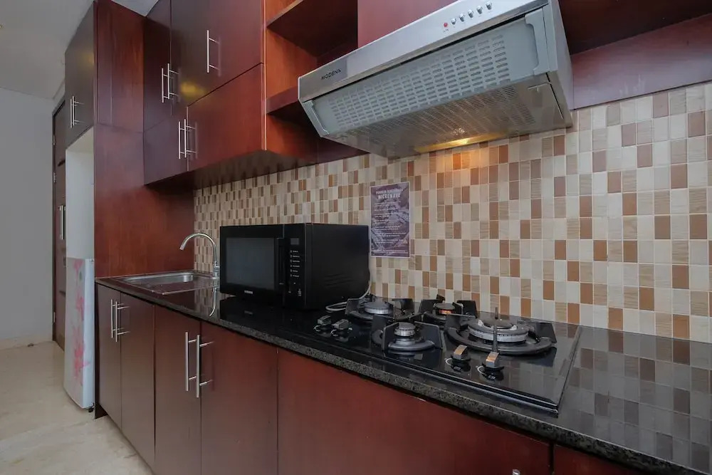 Luxury and Strategic 1BR Apartment at The Empyreal Epicentrum By Travelio