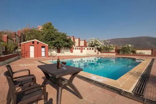 Villa Dazzle by StayVista - Unwind in a Mountain-City View Villa with a Terrace Pool