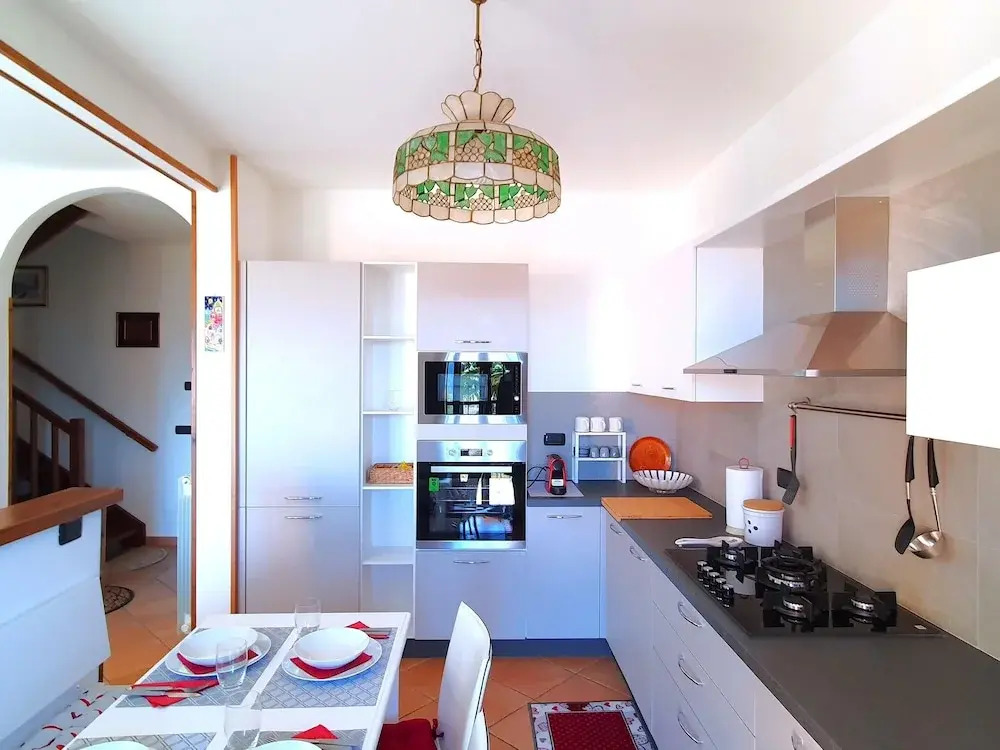 House in Luino with Green Garden and City Views