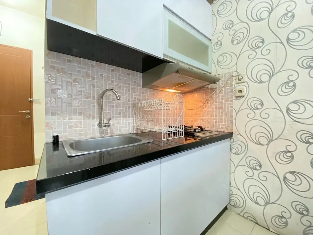 Cozy 2BR at Pinewood Apartment By Travelio