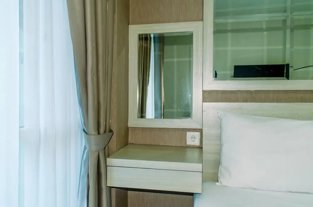 Homey And Warm Studio Room At Tifolia Apartment