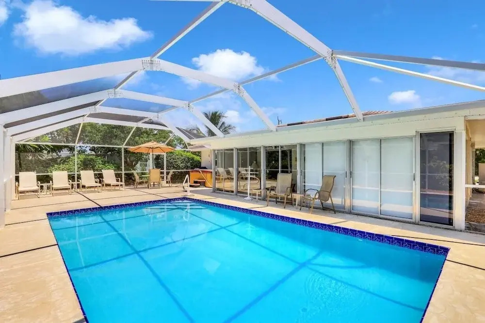 Cozy Home With Sunroom, Pool and Steps to Beach