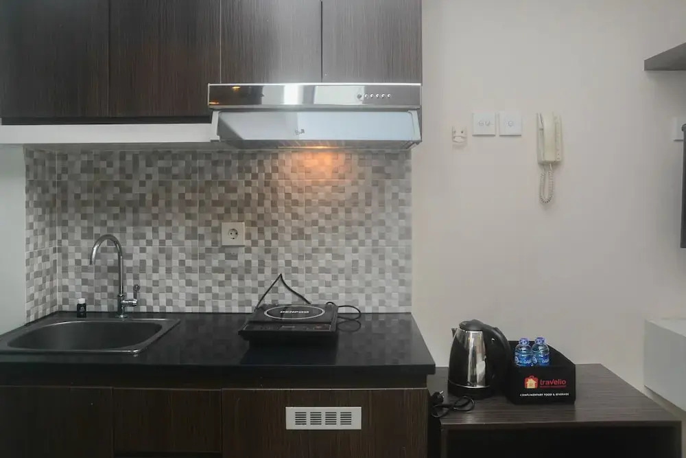 Minimalist and Comfy Studio at Grand Dhika City Apartment By Travelio