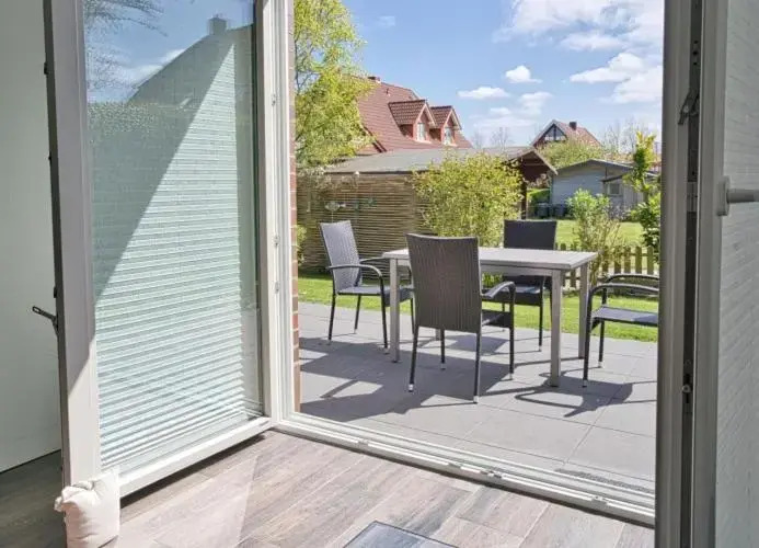 Inselparadies - Neubauwohnung mit großer Terrasse, Strandkorb und Garten