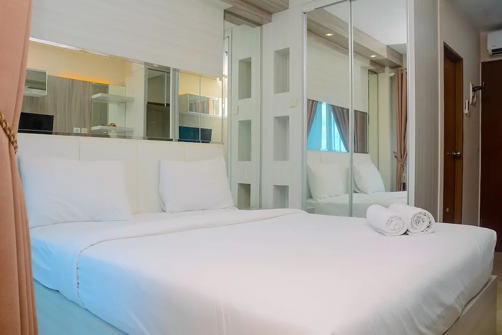 Homey and Cozy Living Studio Room at Tifolia Apartment By Travelio