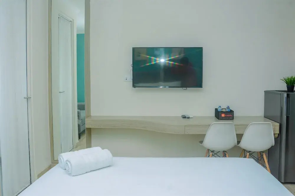 Fully Furnished and Comfortable Design Studio Menteng Park Apartment By Travelio