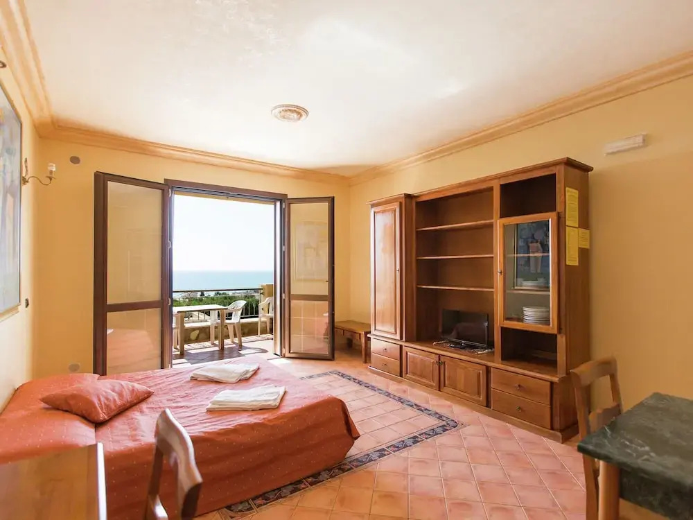 Comfortable apartment with AC very close to the sandy beach