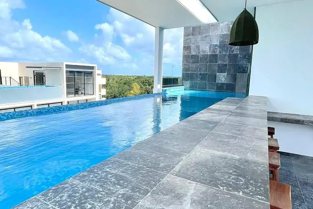 Fresh and Stylish Studio Aldea Zama rooftop pool Mya 109
