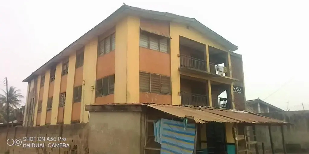 A 2-story building with 2 shops