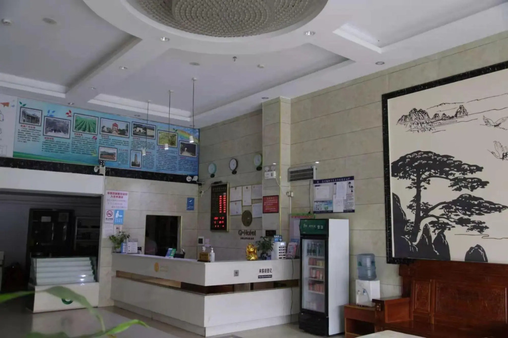 Q+ Nanxiong Xinhewan Business Hotel