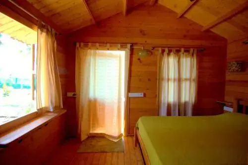 Pele's Windsong Wood Cottage on the beach