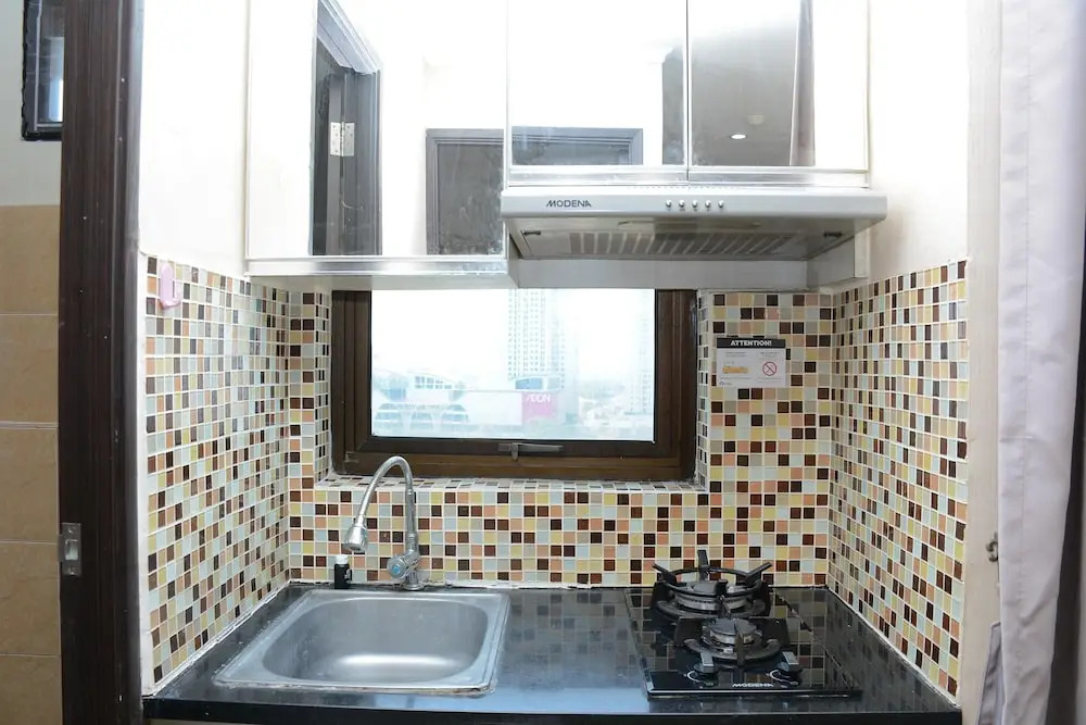 Cozy Living with Modern Design 1BR Kebagusan City Apartment By Travelio