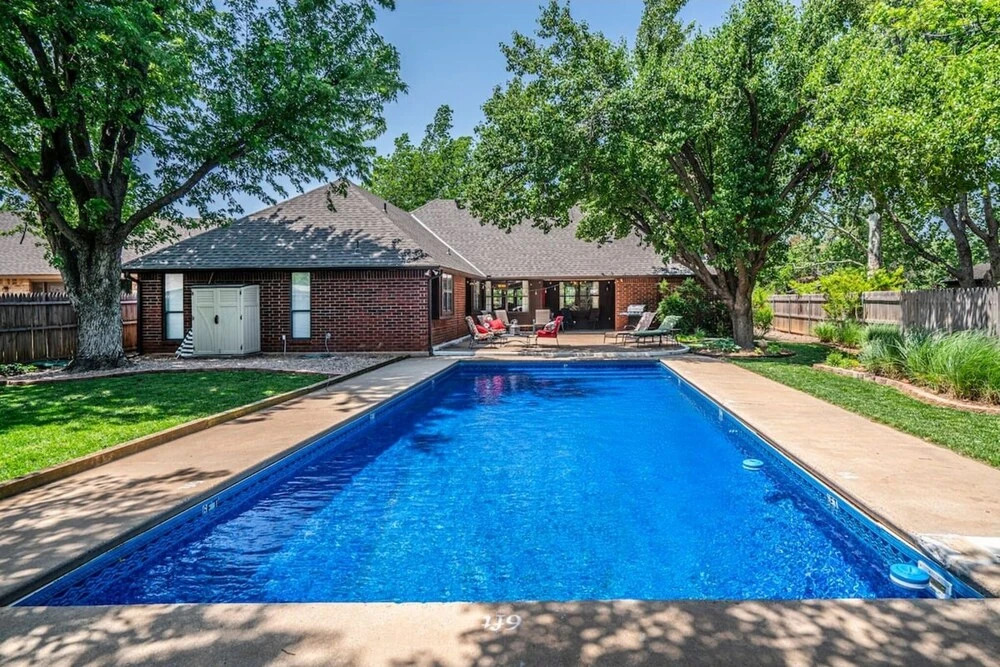 Spacious Retreat With Shaded Yard & Games 4 Bedroom Home by RedAwning