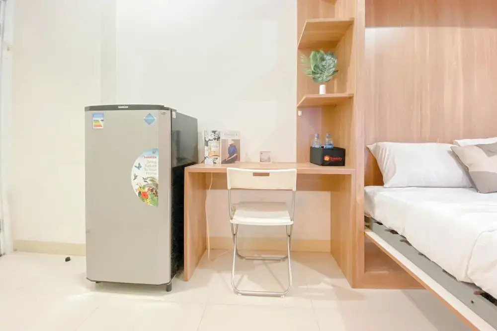 Warm and Well Designed Studio Room at Green Pramuka City Apartment