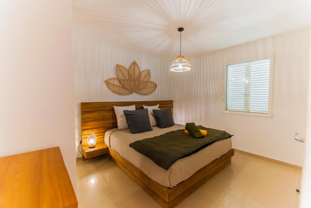 Le Baileys - Spacieux appartement en rez-de-jardin vue lagon