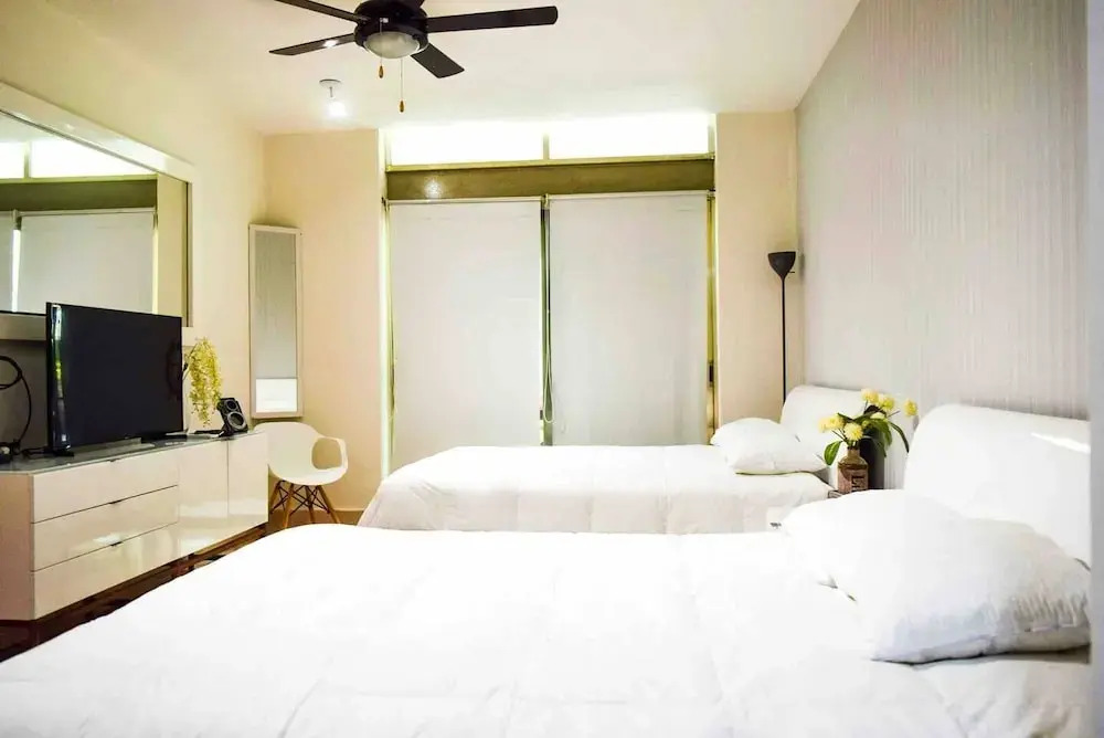 LUXURY CONDO STEPS FROM 5th AV & BEACH