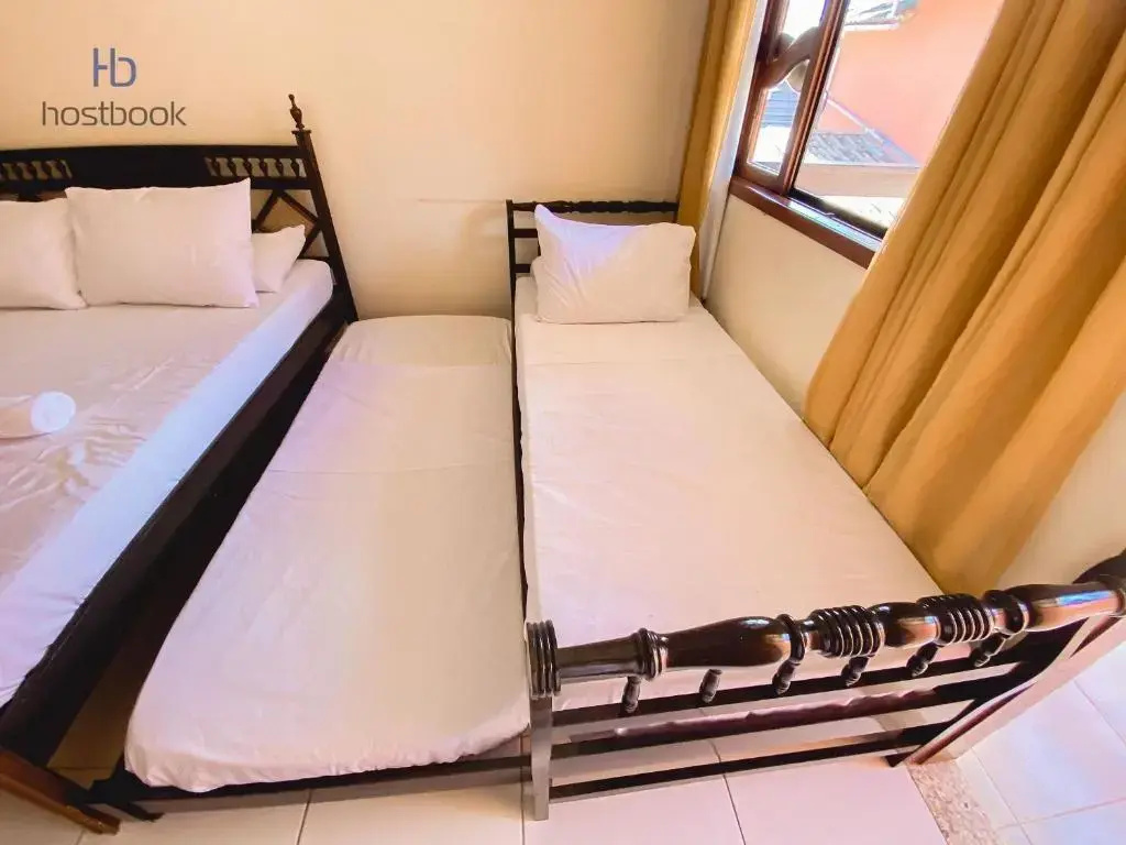 Casa a 400 m da praia do centro - WIFI 200MB - Garagem - TV 500 canais - 2 Quartos - Cozinha equipada - Churrasqueira