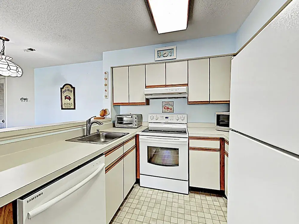 Oceanside Gem W/ Private Deck, Canal Views & Pools 2 Bedroom Condo