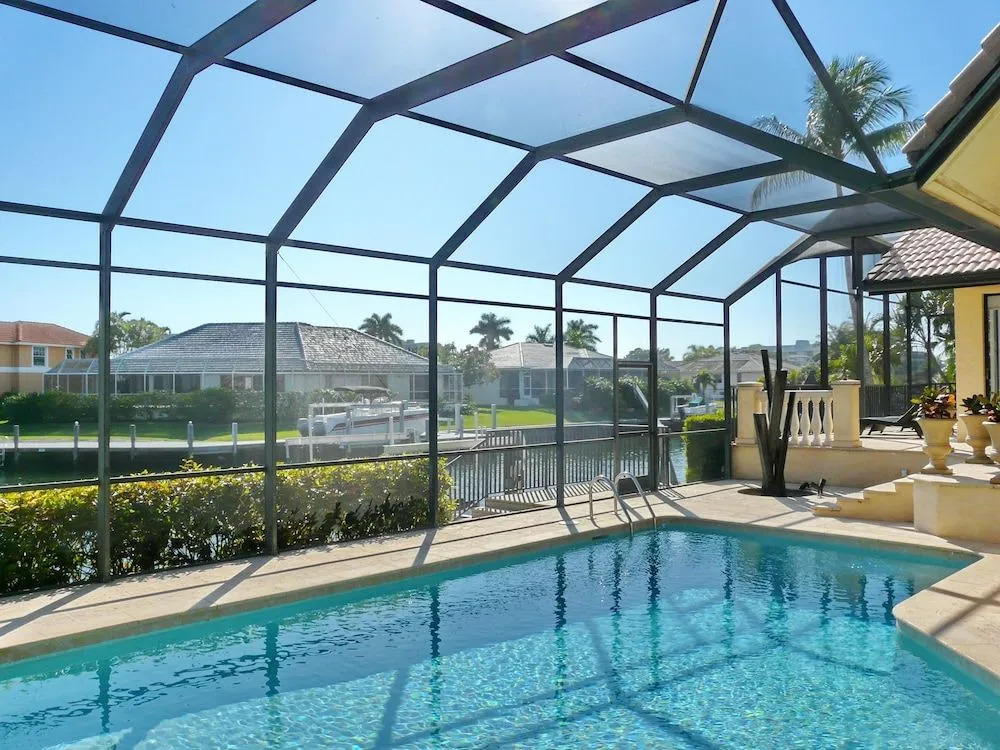 Serene waterfront home with pool, spa, and water view