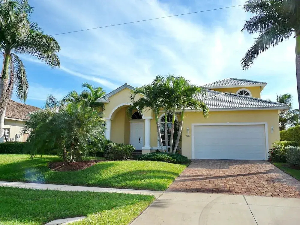 Large waterfront home with all-day sun on pool