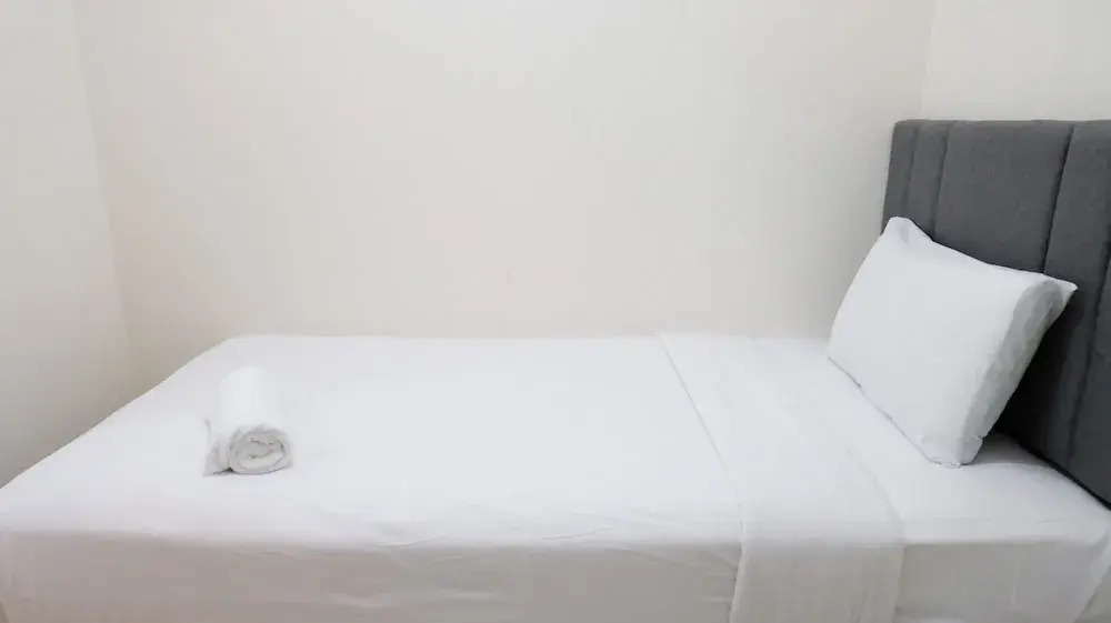 Homey 2BR at Puncak Permai Apartment By Travelio