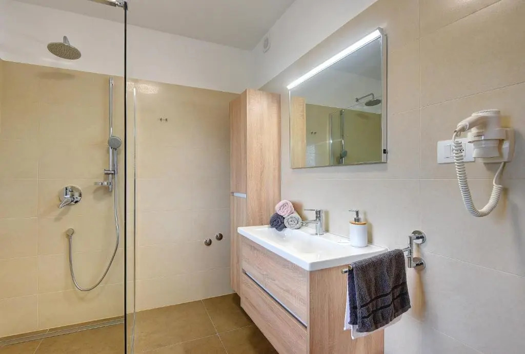 Villa Andrija Family Dream with heated pool at the sea with beautiful garden, outside cinema and kids playground