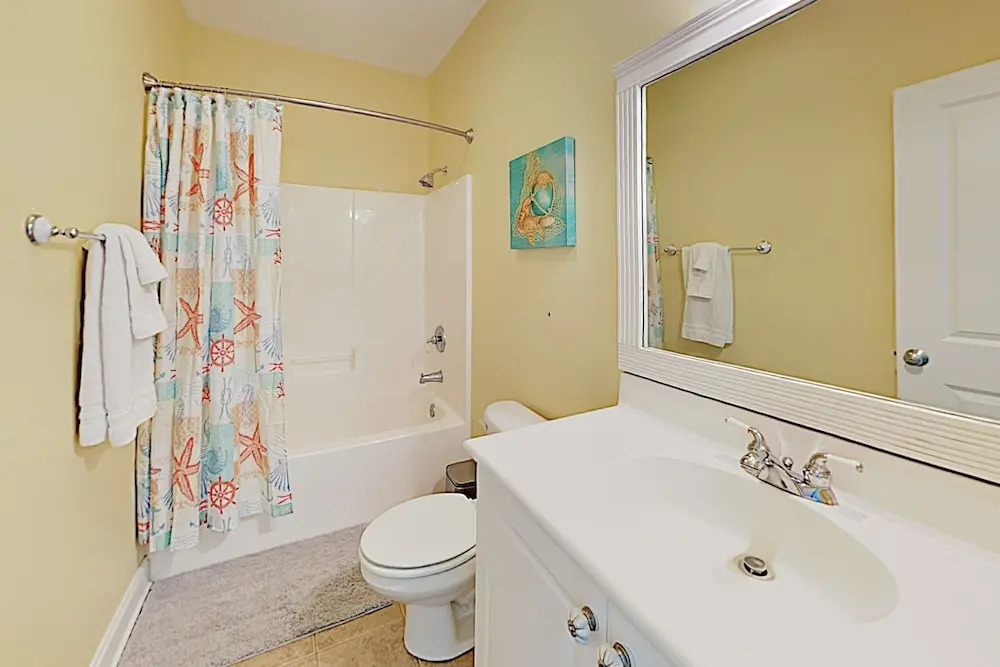 New Listing! Coastal Gem W/ Balconies, Near Beach 4 Bedroom Duplex