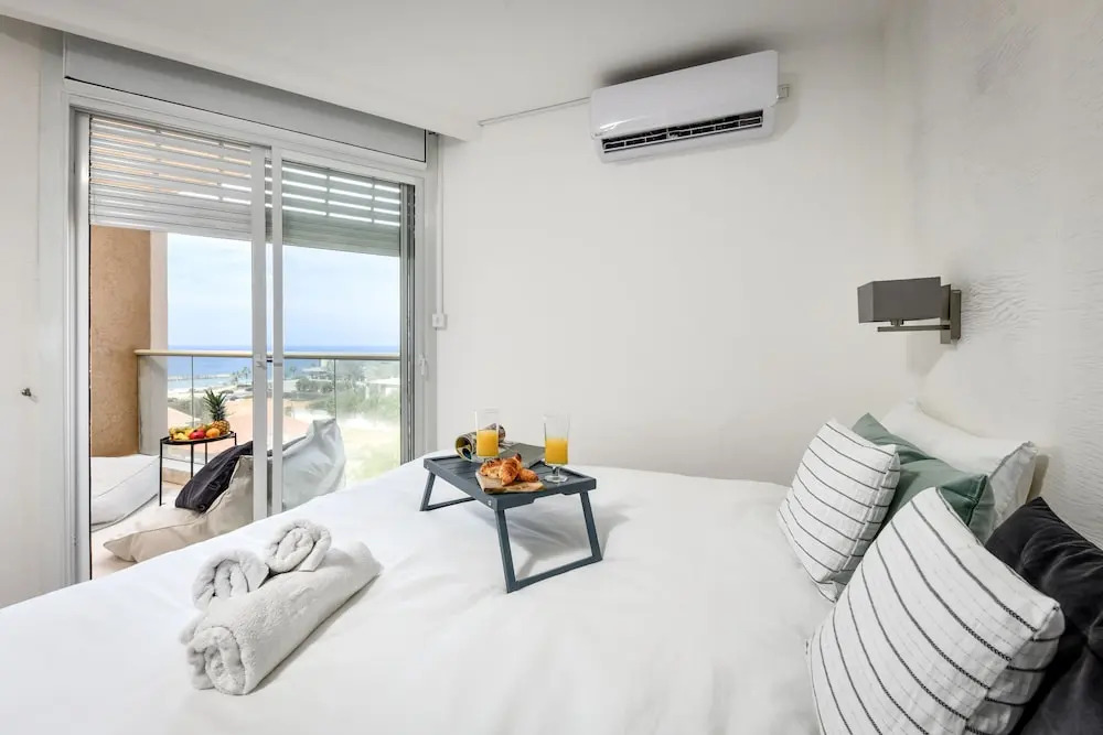 Modern Gem with Stunning Balcony by Sea N Rent