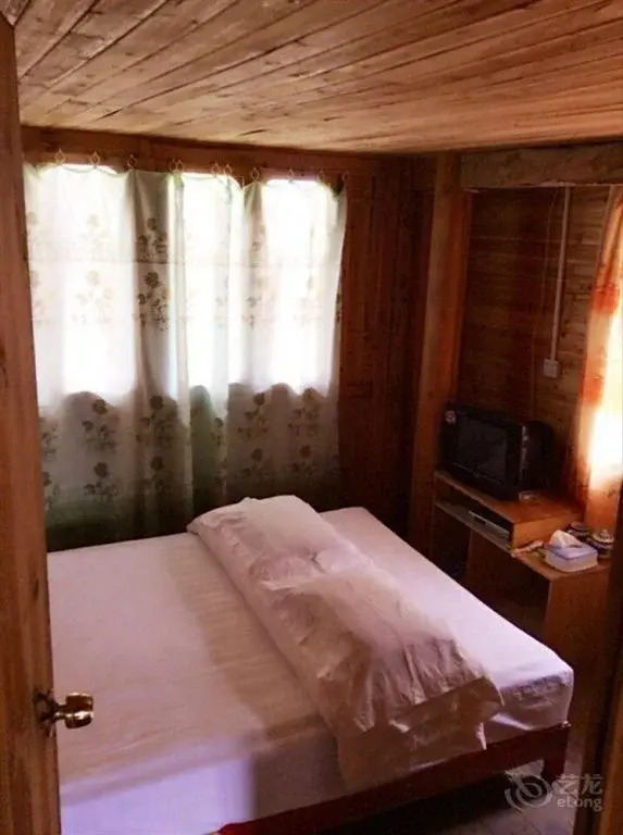 Longsheng Zhaihualou Inn