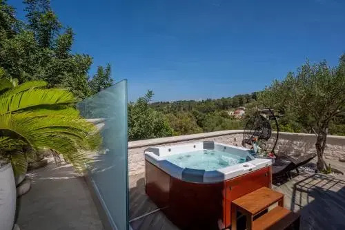 Uniquely designed Villa Ivana with outdoor Jacuzzi nearby the pebble Banje beach at the Island of Solta