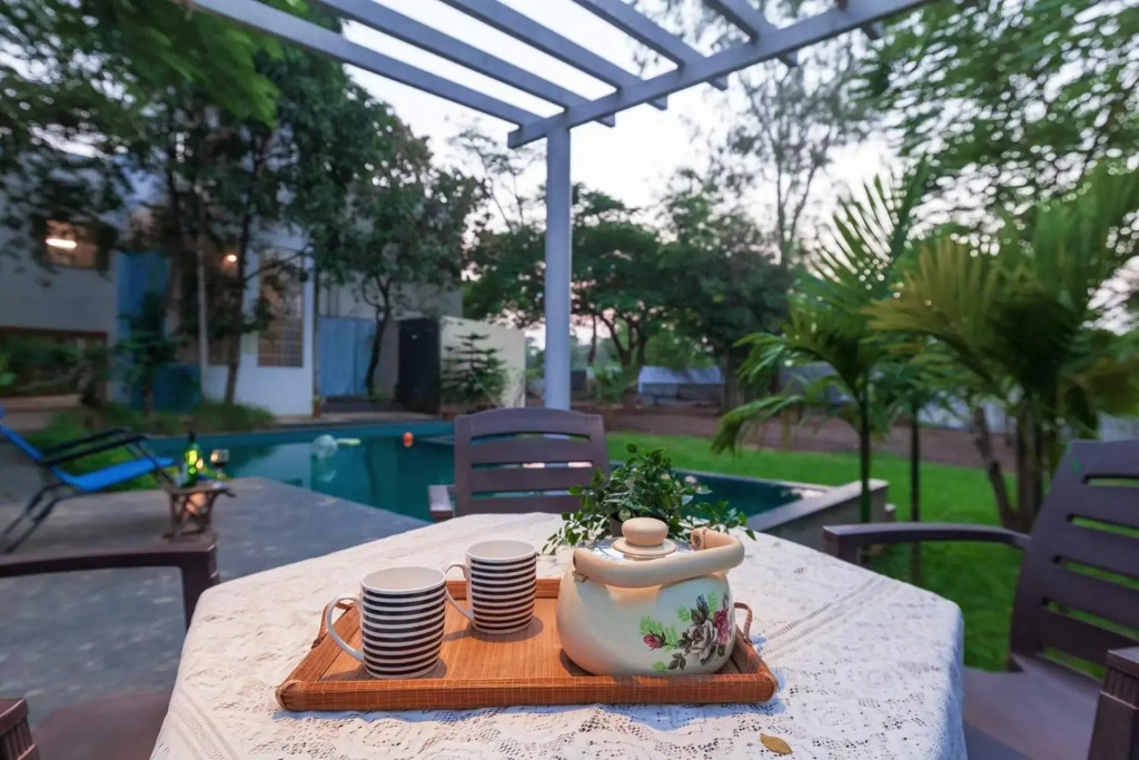 Morning Dew Retreat by StayVista - Modern interiors, Indoor games, Lush greenery, Pool & Gazebo await your escape
