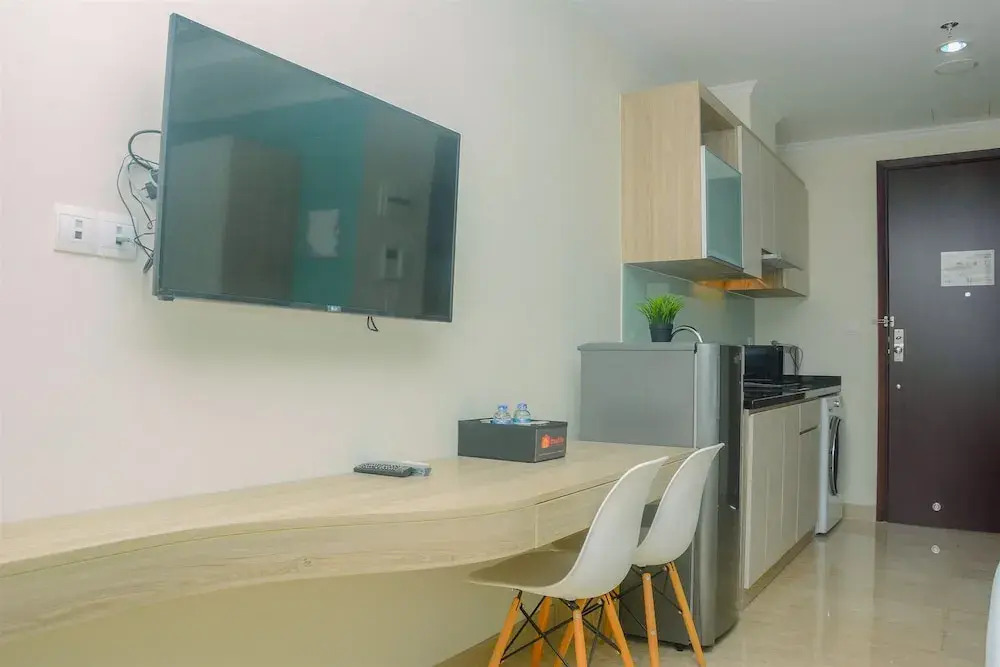 Fully Furnished and Comfortable Design Studio Menteng Park Apartment By Travelio