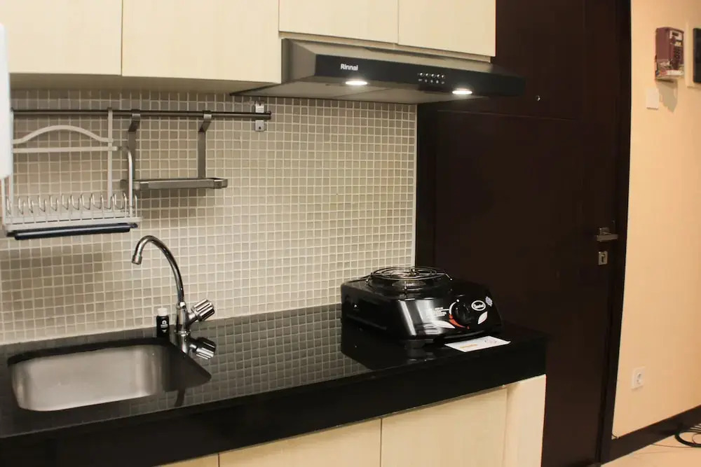 Nice and Comfort 1BR at Sky Terrace Apartment By Travelio