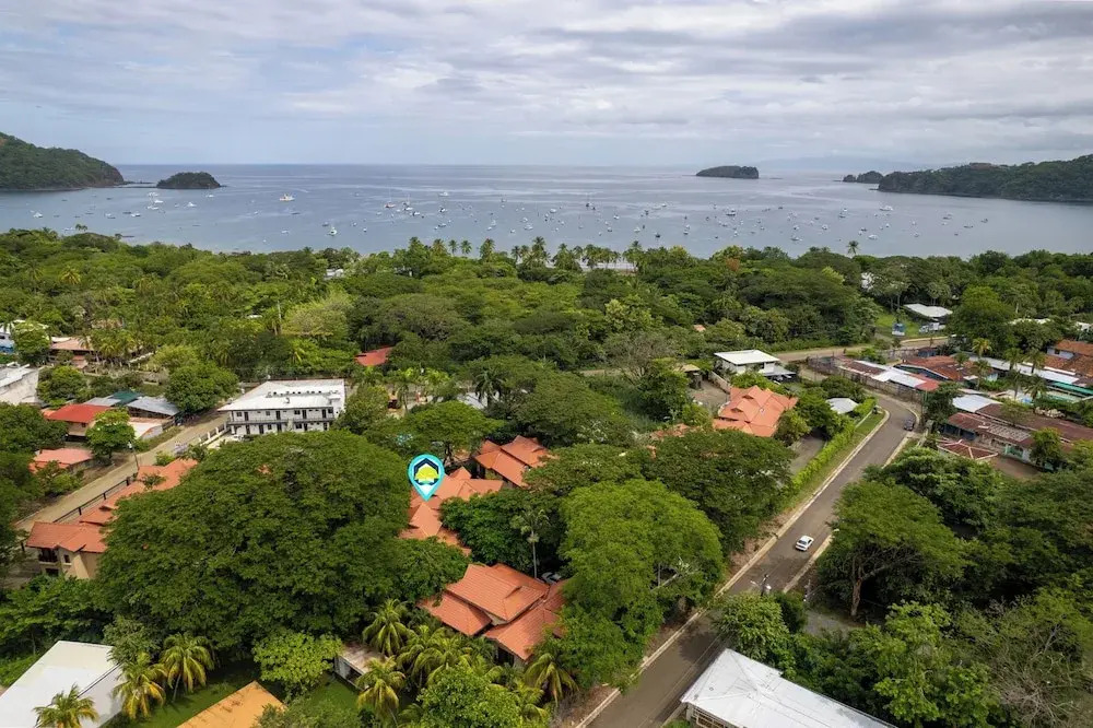 Modern Island-Themed Condo with Floor-to-Ceiling Windows & Garden and Pool Views Within Walking Distance of the Beach