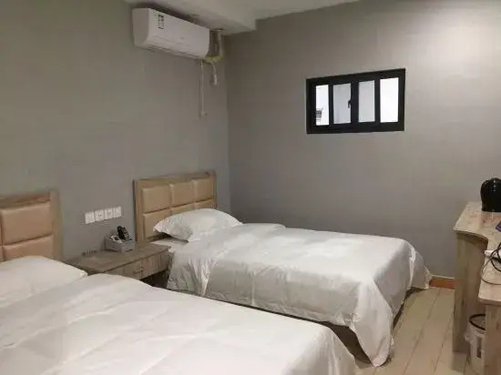 Pinghu liduo sheng business hotel