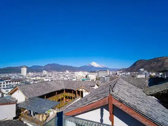 Yuxue Qingcheng Snowview Boutique Inn(御雪晴城·Starrysky日照金山观景美宿（丽江古城大水车店）)