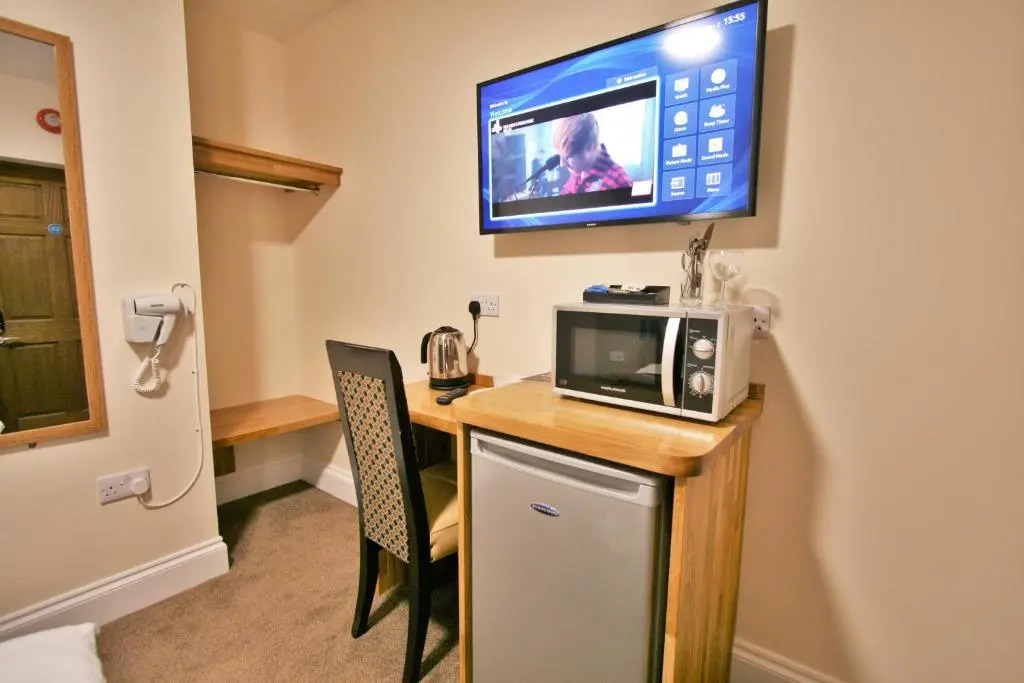 New County Hotel & Serviced Apartments by RoomsBooked