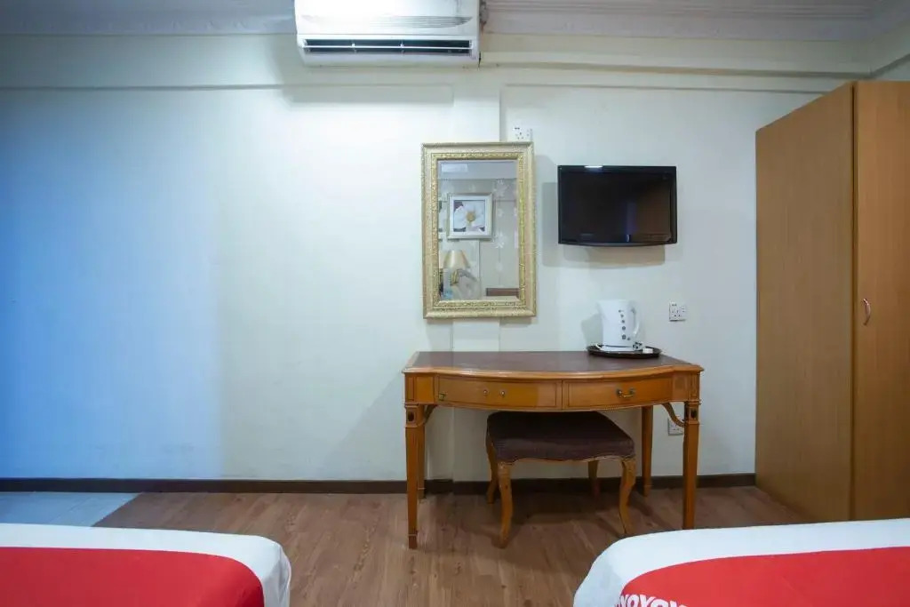 Capital O Hotel Grand Orchard