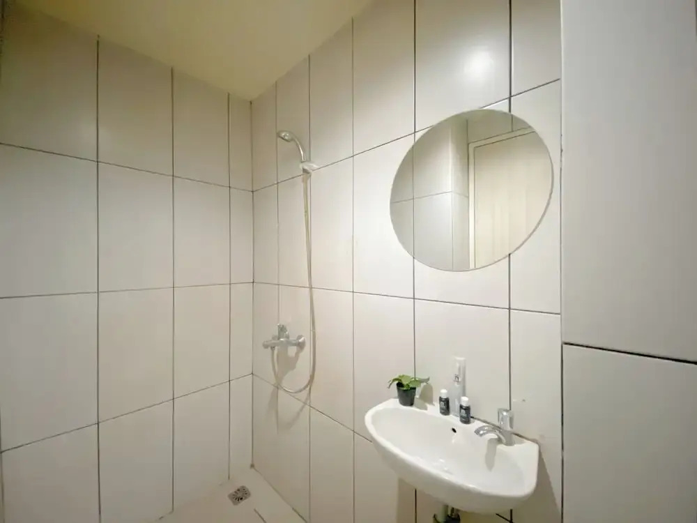 Modern and Homey 1BR without Living Room at Grand Kamala Lagoon Apartment By Travelio