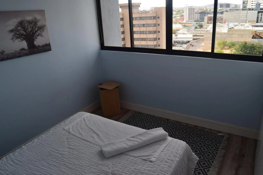Highrise Windhoek apartment with skyline view, pool and gym
