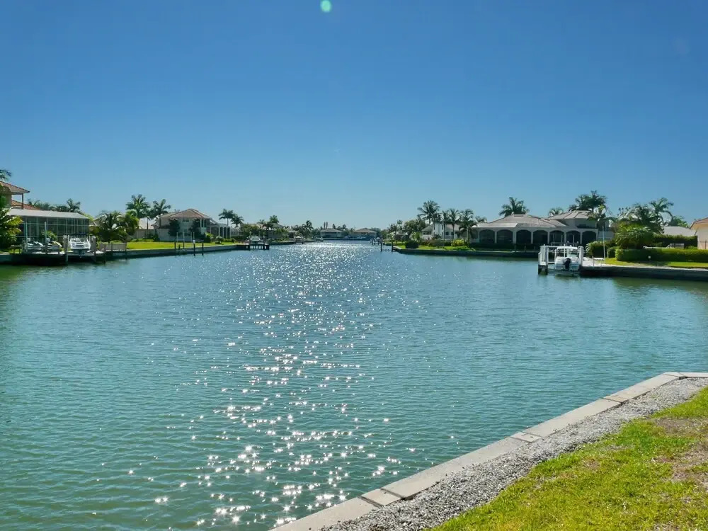 Waterfront home on key lot with pool, spa and views