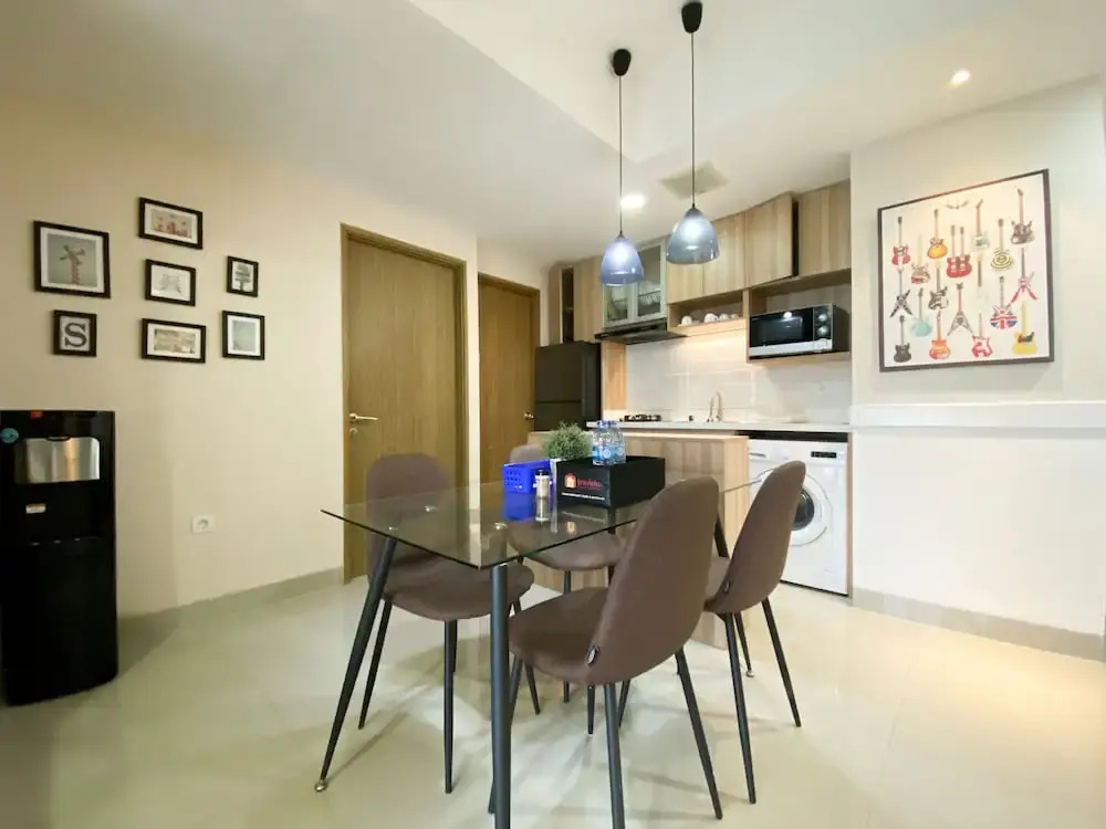 Cozy and Minimalist 2BR at 8th Floor The Oasis Cikarang Apartment By Travelio