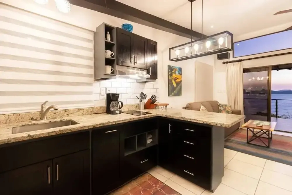 Modern Studio Apartment with Covered Balcony, Full Kitchen, and Stunning Ocean Views